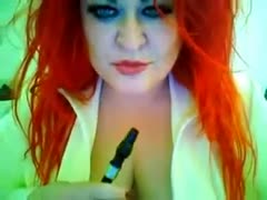 This red-haired seductress with large whoppers looks so sexy during the time that smokin'